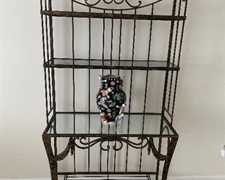 Metal storage rack with glass shelves - excellent condition and shown with a porcelain vase