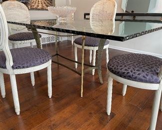 metal and glass dining table with ripple edging. white-washed dining chairs with aubergine upholstered seats (6) 