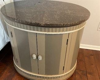 Designer oval side table with lower cabinet/nightstand with marble top shown with glimmer pulls 