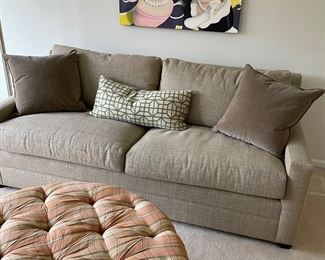 2 cushion couch, ottoman, artwork, and pillows