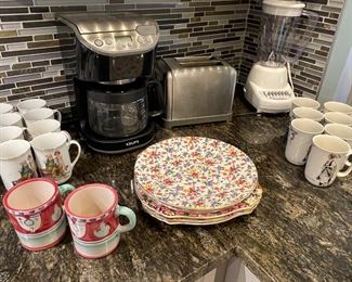 Small appliances:  Krups coffee maker, toaster, blender; coffee mugs and french plates