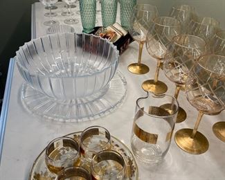 Barware:  basic glassware, gold rimed low-ball glasses, glass and plate for appetizers, and coasters