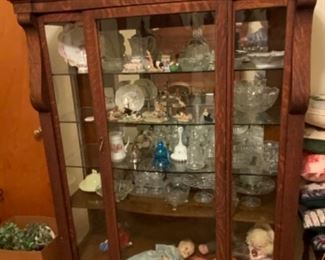 Antique tiger wood display cabinet with key.