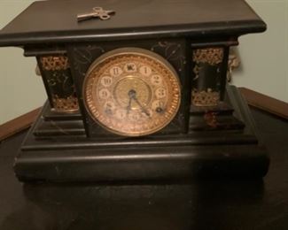 Antique clock with key.