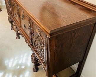 $395 
&nbsp;Wood Oak & Burl Walnut Sideboard highly carved 
64Lx19Dx35 1/2T