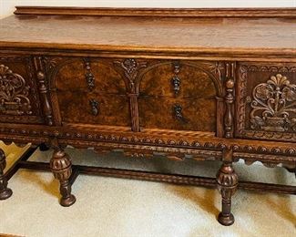 $395 
&nbsp;Wood Oak & Burl Walnut Sideboard highly carved 
64Lx19Dx35 1/2T