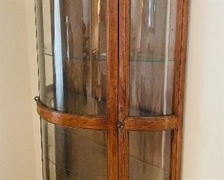 $250 
Curio bowfront walnut 40Lx18Dx72T New