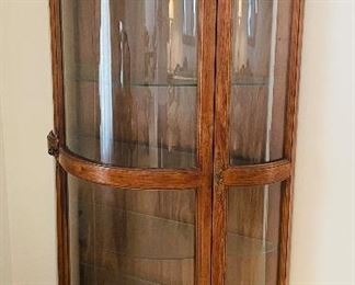 $250 
Curio bowfront walnut 40Lx18Dx72T New
