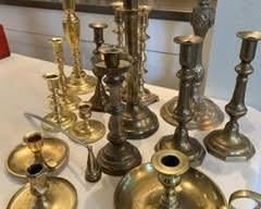 Antique brass candlesticks for sale during in-person shopping Friday and Saturday.