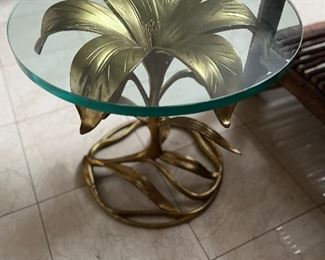$280 Glass and brass table.  as found  17.25”  by 19”diameter.