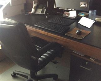 Vintage – 1950’s. Desk and rolling filing cabinet. Black leather top, rosewood body and chrome legs. Desk has drawer at center. Desk is roughly 72" x 30" x 29"h.  File (letter and legal folders) cabinet is black steel with rosewood top, shepherd casters.  Chair not for sale.