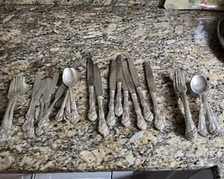 $1000. Sterling silver Cottage Rose by Alvin.  Six six-piece place settings with two extra knives, two extra dinner forks, two extra soup spoons and a carving set.