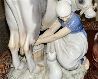 Milkmaid milking a cow while the cat looks on, Bing & Grondahl figurine 