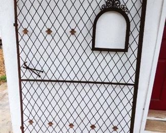 Antique iron gate with mailbox opening 