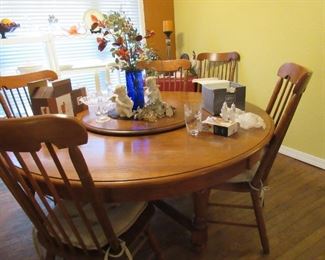 large round dining table w/ lazy susan & 6 chairs