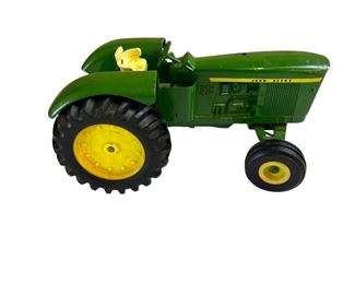 John Deere toy (1" long)