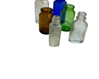 collection of colored glass bottles