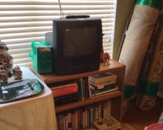 portable TV with built-in VCR, rolling cart, books