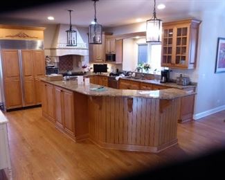 This group of photos is the Kitchen Cabinets with the Island. The $6,750.00 was, How $3,850.00  includes all the Granite, Lighting, Desk & Butler Station.
