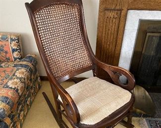 Antique caned rocking chair 