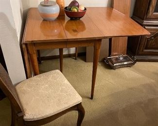 Vintage mid century wood dining table with extra leaves and pads 