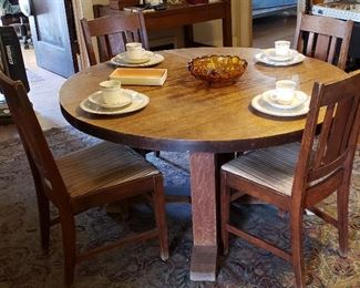 Large Oak Dining Table w/ Six Leave & 8 Chairs, possibly Stickley, but couldn't find a label