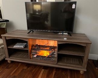 Media Cabinet.  Shown with Fireplace insert and one of 3 TV's
