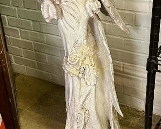 Tall white porcelain parrot.