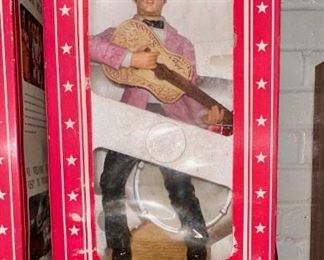 Elvis in pink suit whiskey decanter in original box.  Several available.