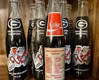 Vintage Coke bottles.  There are other vintage (empty) bottle for sale.