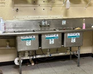 Stainless steel triple commercial sink.