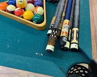 Mizerak Pool Table, balls and cues.  Accepting bids and will sell to highest bidder at end of sale.