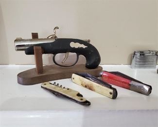 Antique gun lighter, old knives