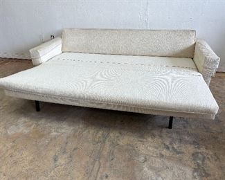 Vintage Danish pull out sofa bed. Seat cushion unfolds to create bed. 