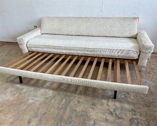 Vintage Danish pull out sofa bed. Seat cushion unfolds to create bed. 