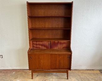 Teak Bookcase by Johannes Sorth for Bornholms Mobelfabrik. Has pull out shelf and tambour doors. 