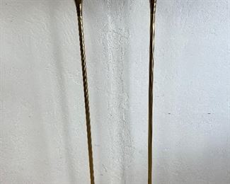 Pair of vintage brass floor lamps. One lamp has warped cone shade as pictured. 