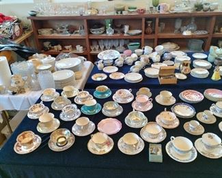 Many cups and saucers.