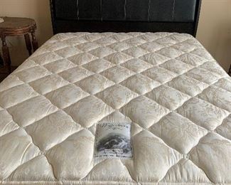 Queen size leather and wood headboard, footboard, and frame, mattress sold seperately