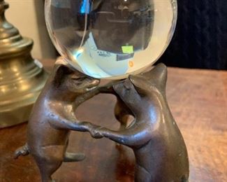 brass pigs holding crystal ball
