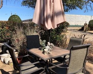 small patio set with umbrella and 4 chairs