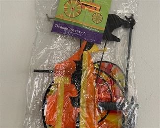 orange tractor spinner flag