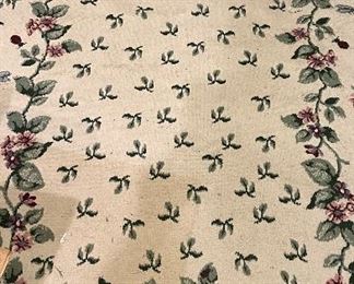 Floral Rug. Measures 5' x 7'.