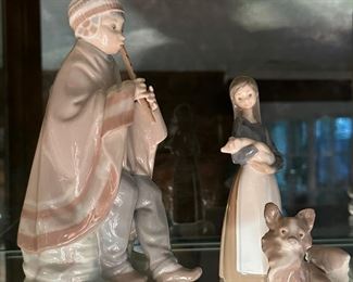 Lladro Nao Bisque Figure of a Shepherd Boy with Flute, Lladro Girl with Pig, Lladro Small Dog