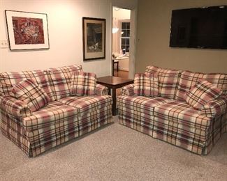 Pair of plaid love seats