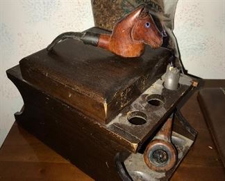 Pipe holder with Horsehead pipe and tobacco