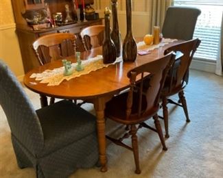 Dining table with 2 leaves, 4 wooden chairs, and 2T upholstered chairs - also have table pad that goes with the set