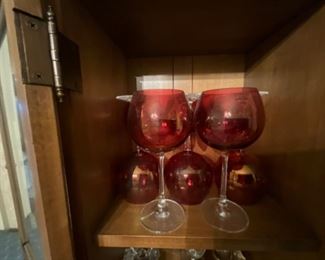 China cabinet contents - red & white stemmed glasses set