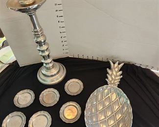 Pewter candlestick, pineapple dish, saucers and metal bowls