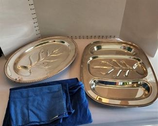 Silver serving trays and silvercloth bags
